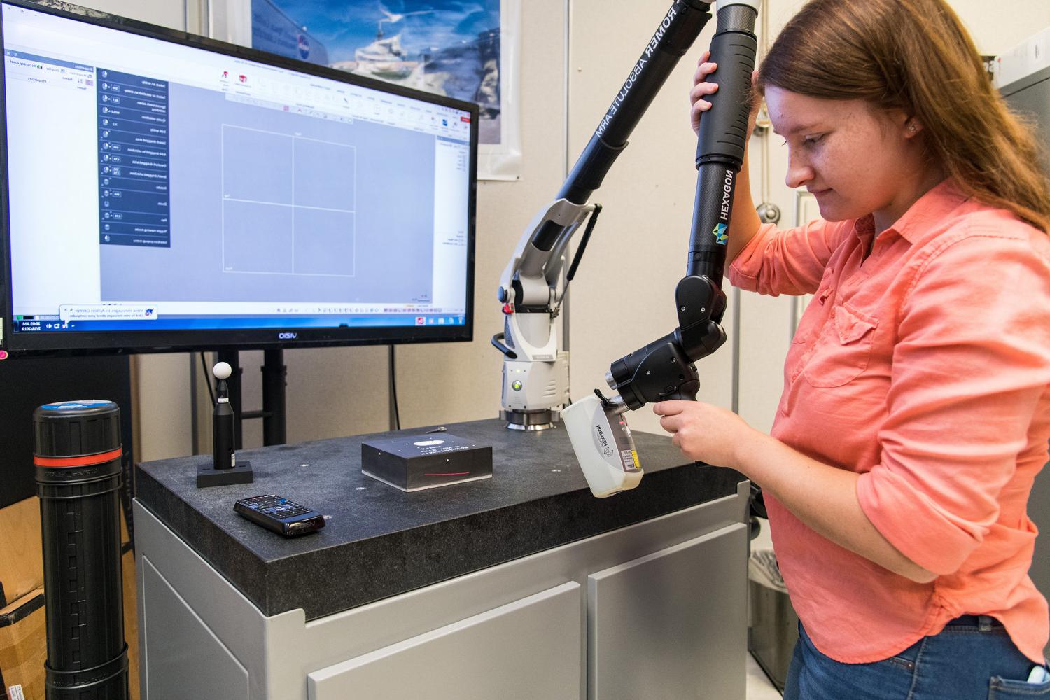 bv伟德ios下载女校友, Megan Janiak, working at NASA's Kennedy Space Center during her internship.